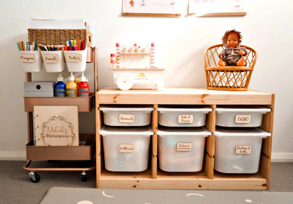 organised playroom with wooden toy box labels