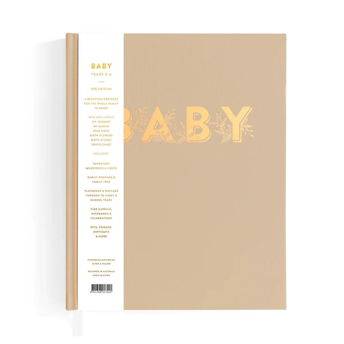 Beige baby book with gold lettering