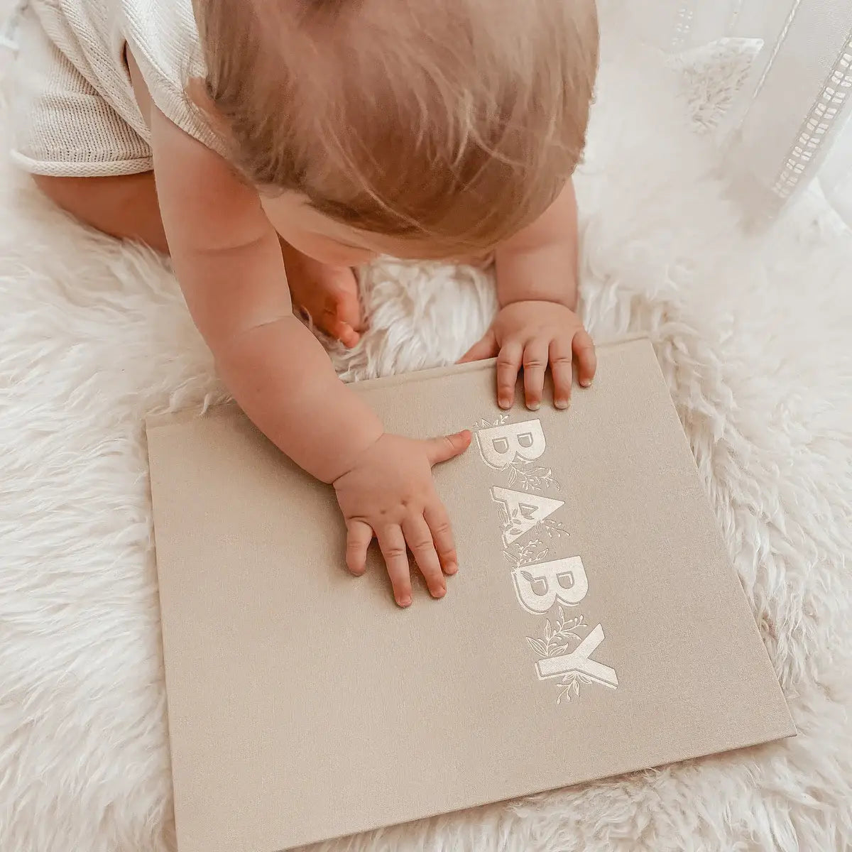 Baby Book with child for size scale. Brown Baby journal cover.