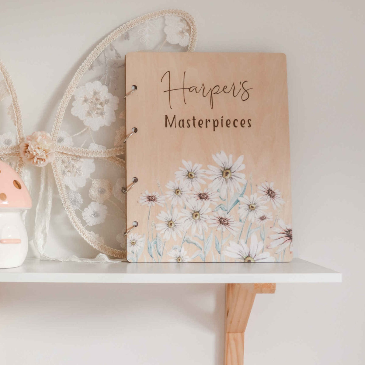 Wild Daisy personalised children's art binder on shelf — Australian made keepsake folder