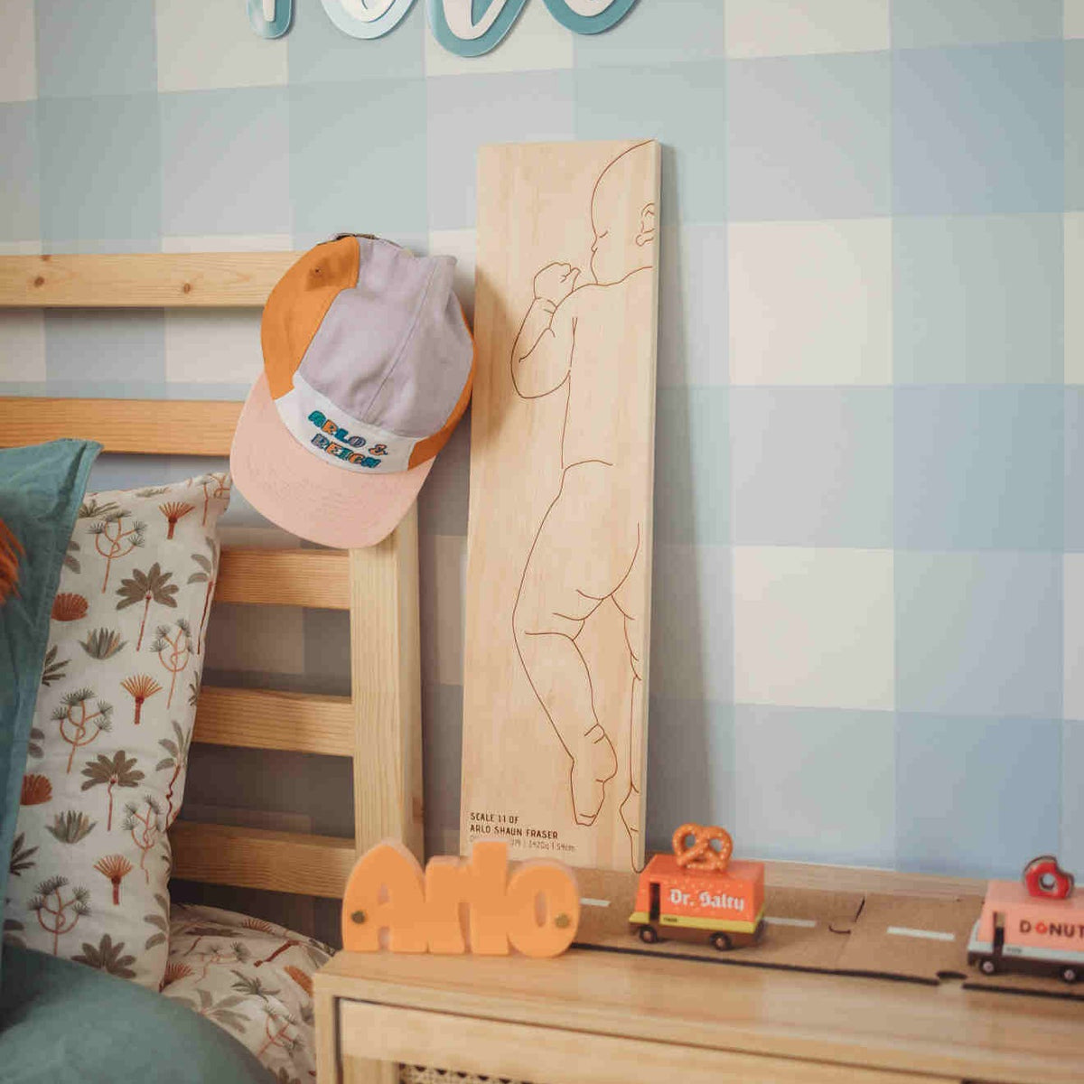 Charlie birth ruler in kids room — personalised wooden baby keepsake on display