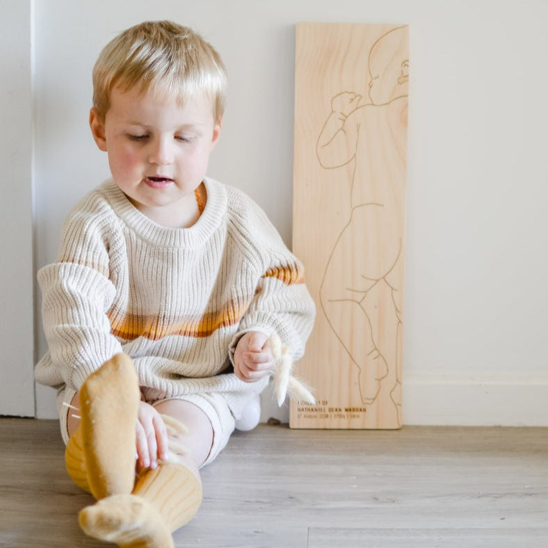 Charlie personalised birth ruler with toddler for scale — Honeycomb Living Australia