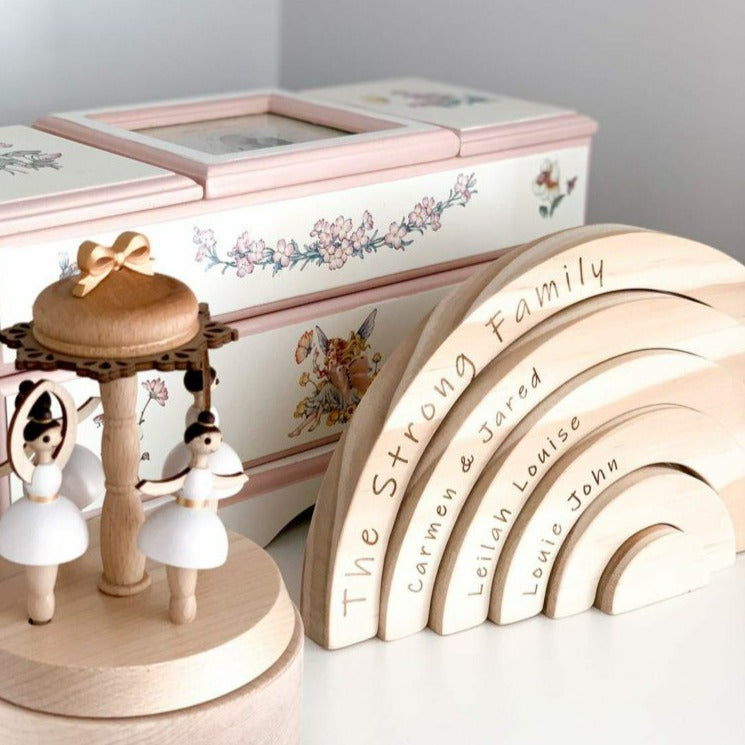 Family rainbow side view showing individually engraved wooden arches — Honeycomb Living
