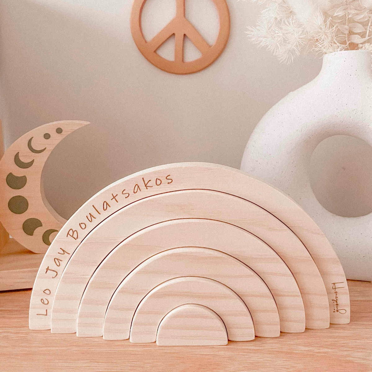 Personalised wooden name rainbow — baby's name engraved on top arch, handmade in Australia