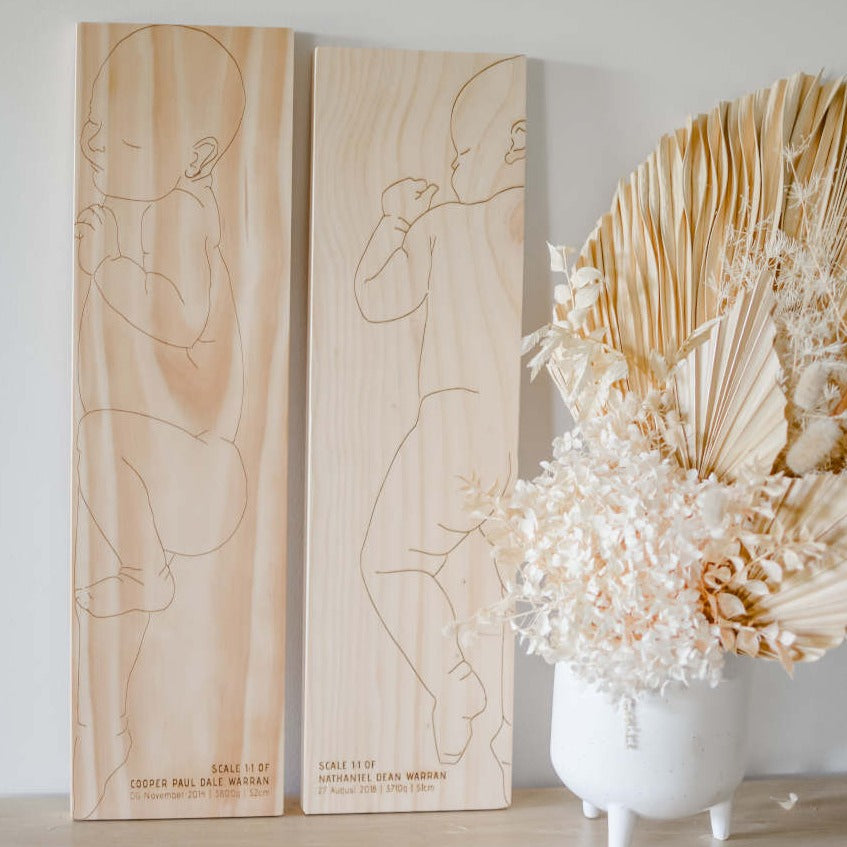 Sawyer and Charlie birth rulers side by side — two personalised wooden baby keepsake designs